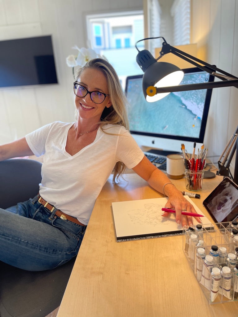 Jennifer Lauren Friedman working in her studio, painting personalized pet portrait commissions. She's currently working on a mini poodle watercolor piece, 9x12 arches watercolor paper. 